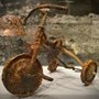 a childs rusted trike damaged by the atom bomb dropped on Hiroshima