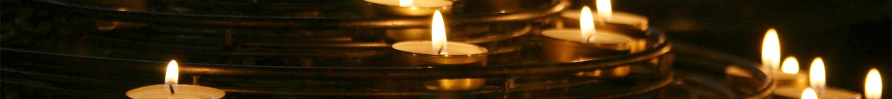 small votive candles on a tiered metal stand