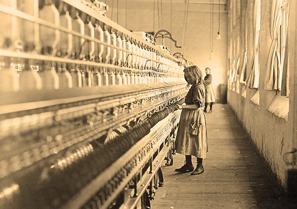 a young girl working in the Lancaster Cotton Mills