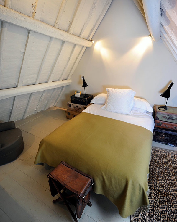 a bed in an attic room