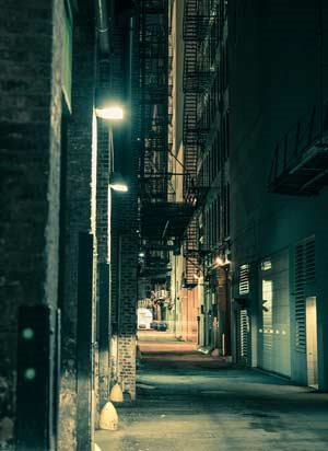 a dark street alley