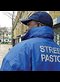 street pastor wearing blue windbreader