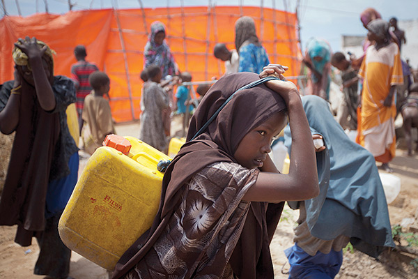 a young girl hauling water in Djibouti