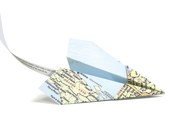 origami airplane made with the map of Haiti