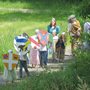 kids dressed as knights and ladies walking along a path