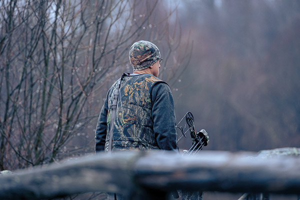 Tim Maendel heads to the woods with his bow.