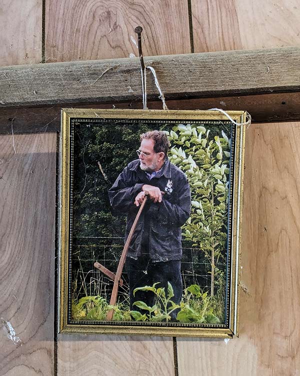 A photograph of the author’s father hangs in the barn at the Fox Hill Bruderhof.