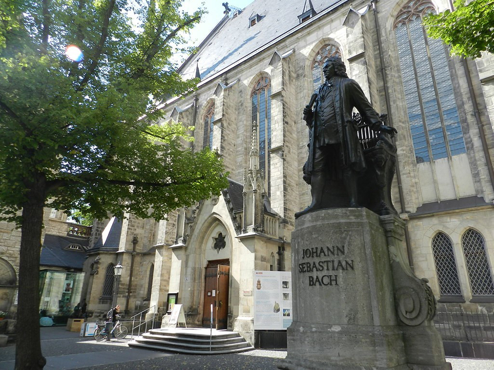 statue of Bach in front of a church