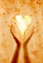 painting of hands with a heart in red and gold
