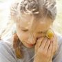 a girl holding a duckling