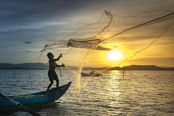 a man fishing with a net