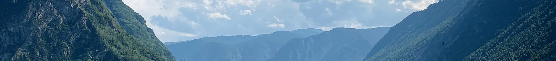 mountains and clouds reflected in a lake