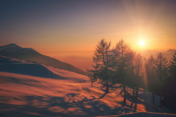 sunrise over snowy landscape