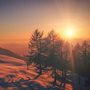 sunrise over snowy landscape