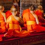 Monks in Thailand, dressed in bright orange robes