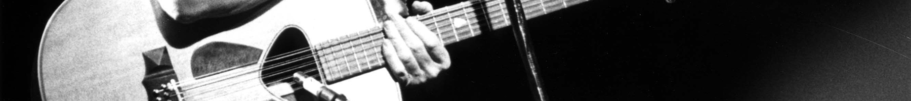 black and white photograph of Pete Seeger singing