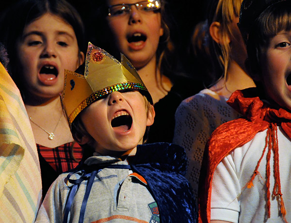 a child dressed as a king in a Nativity pageant