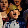 a child dressed as a king in a Nativity pageant