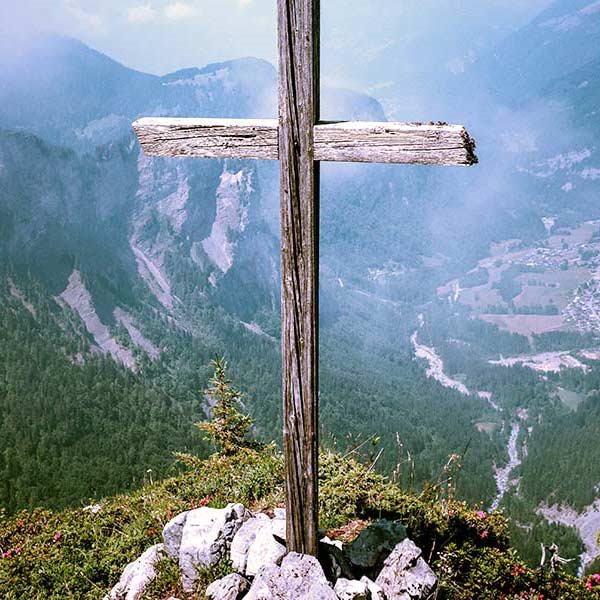 A wooden cross in the mountains