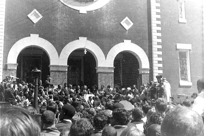 Dr. Martin Luther King Jr. speaking to a crowd outside Browns chapel in Selma, Alabama, 1965. This is the fullsize image.