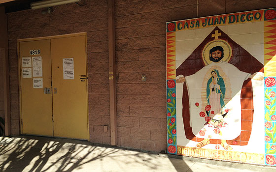 The closed door and mural of the Casa Juan Diego Catholic Worker in Houston.