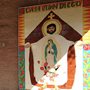The closed door and mural of the Casa Juan Diego Catholic Worker in Houston.