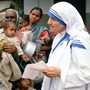 Mother Teresa with mothers and children at her Mission in Calcutta India