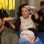a woman serving Thanksgiving dinners at a soup kitchen