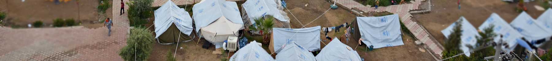 white tents in a refugee camp