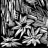 black and white woodcut of a flower in grass