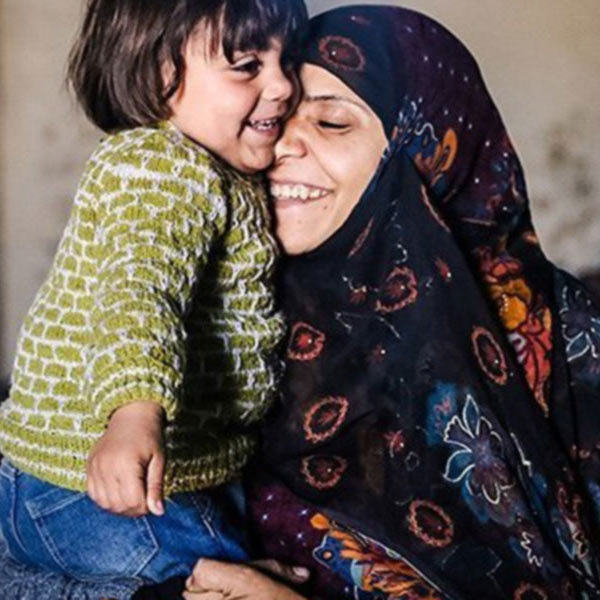 a mother hugging her child