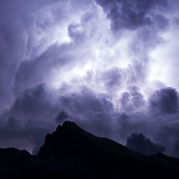 lightening in a cloud over a mountain