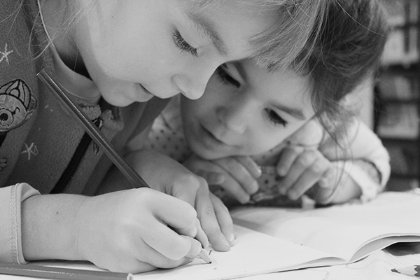 two sisters doing homework