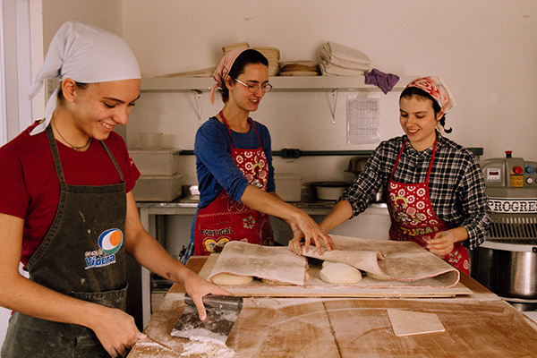 three women making bread