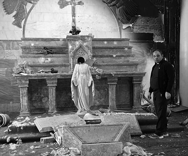 Father Thabet Habib, parish priest of Karamles, Nineveh Province, Iraq, on his first entry to his church, Mar Addai, after ISIS had been pushed out three days earlier.