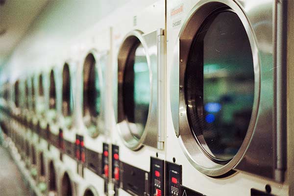 row of white washing machines