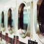 row of white washing machines