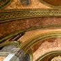green and golden tiles on a cathedral ceiling