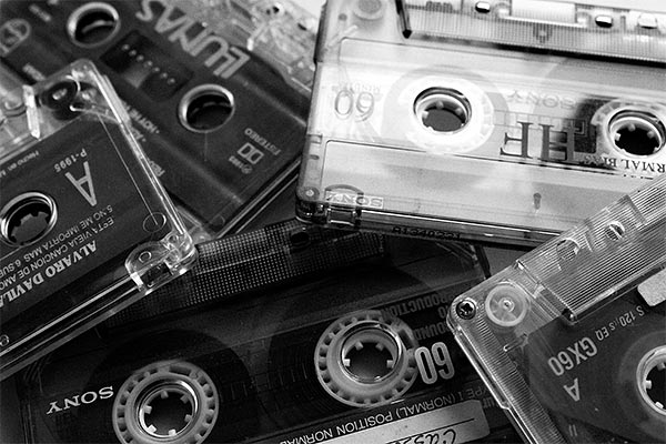 black and white photo of a pile of cassette tapes