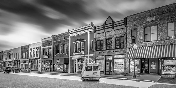 black and white photo of a street in an Iowa town
