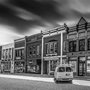 black and white photo of a street in an Iowa town