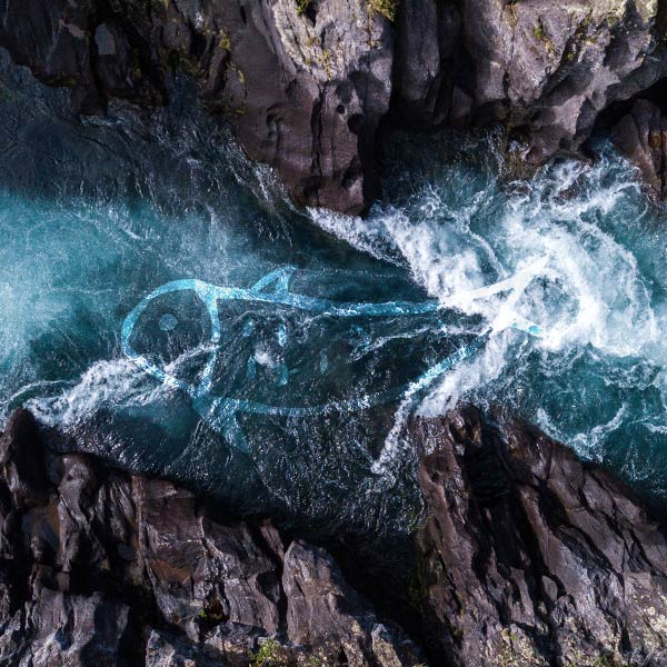 photo of rapids in a river overlayed with an Early Christian drawing of a fish