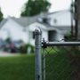 fence and gate between suburban homes