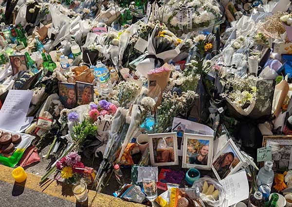 pile of flowers and photos