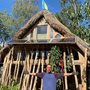 Mark in front of the house he built
