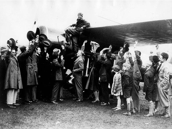 May 21, 1932 - Londonderry, Ireland - The female aviator Amelia Earhart, the first woman to fly alone across the Atlantic receives cheers from the crowd after touching down in North Ireland
