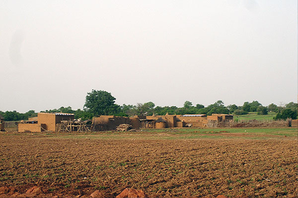field and village in Burkina Faso