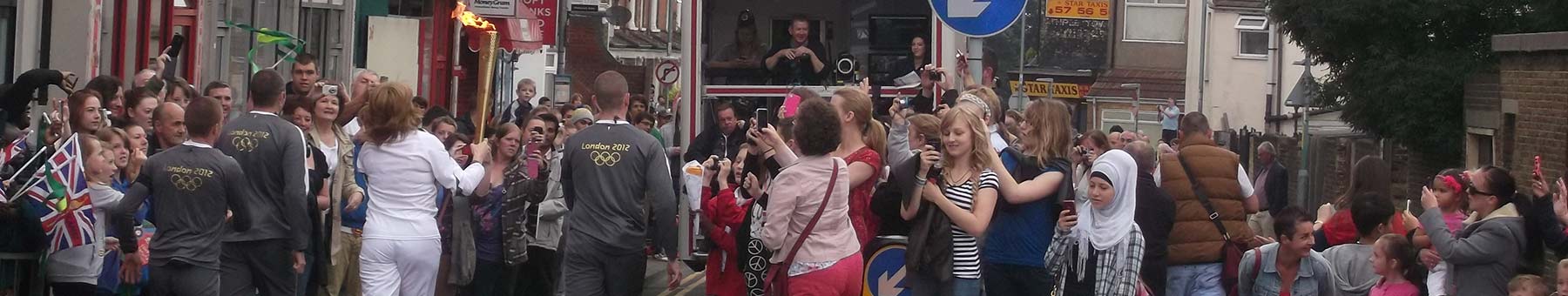 Olympic Torch Runner and crowds on Canterbury Street