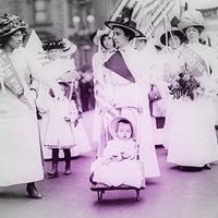 women lining up for parade; woman in front leading with baby and carriage, Suffrage parade, New York City, May 4, 1912