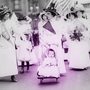 women lining up for parade; woman in front leading with baby and carriage, Suffrage parade, New York City, May 4, 1912